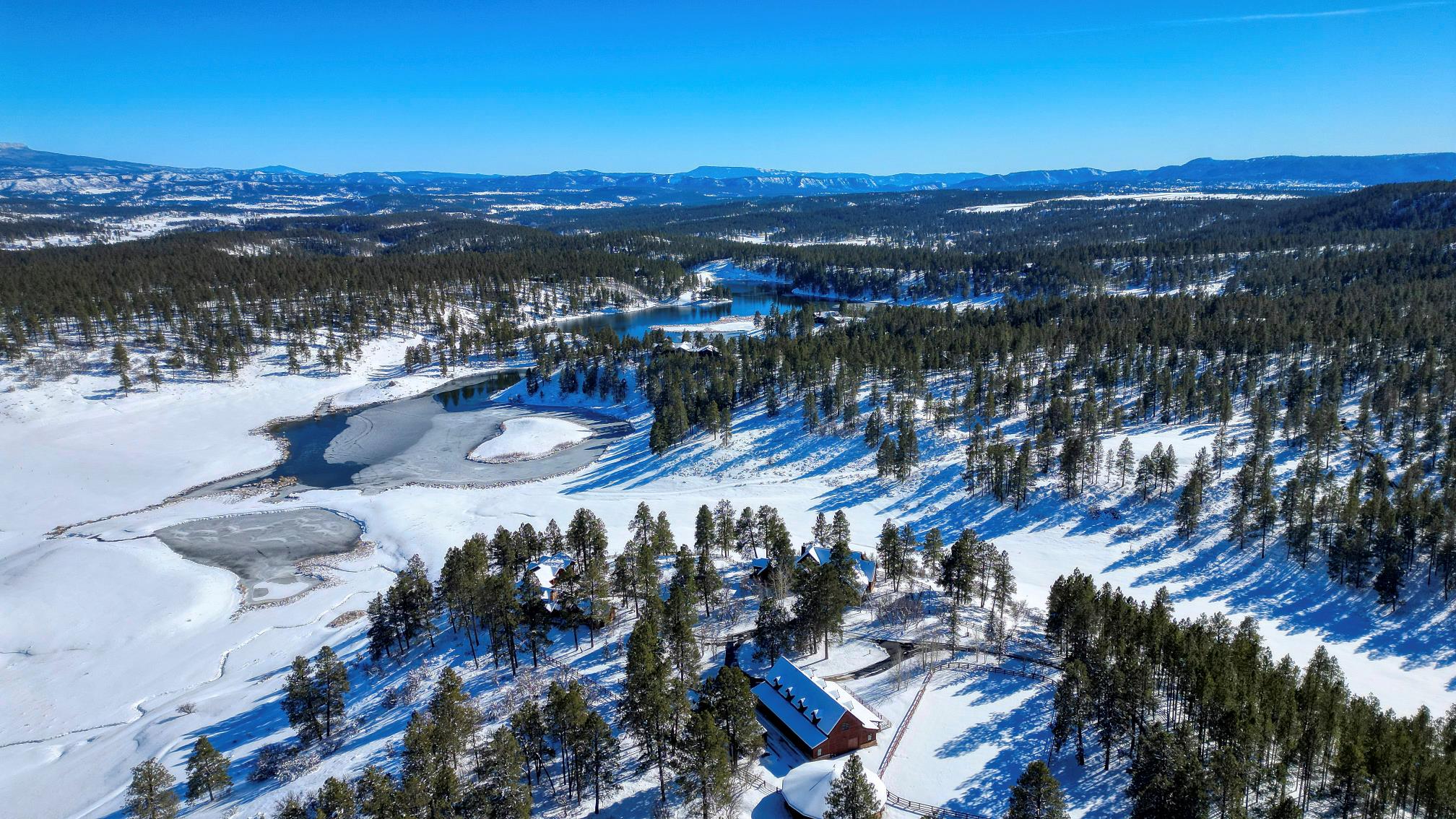 Winter aerial of the compound above the lake