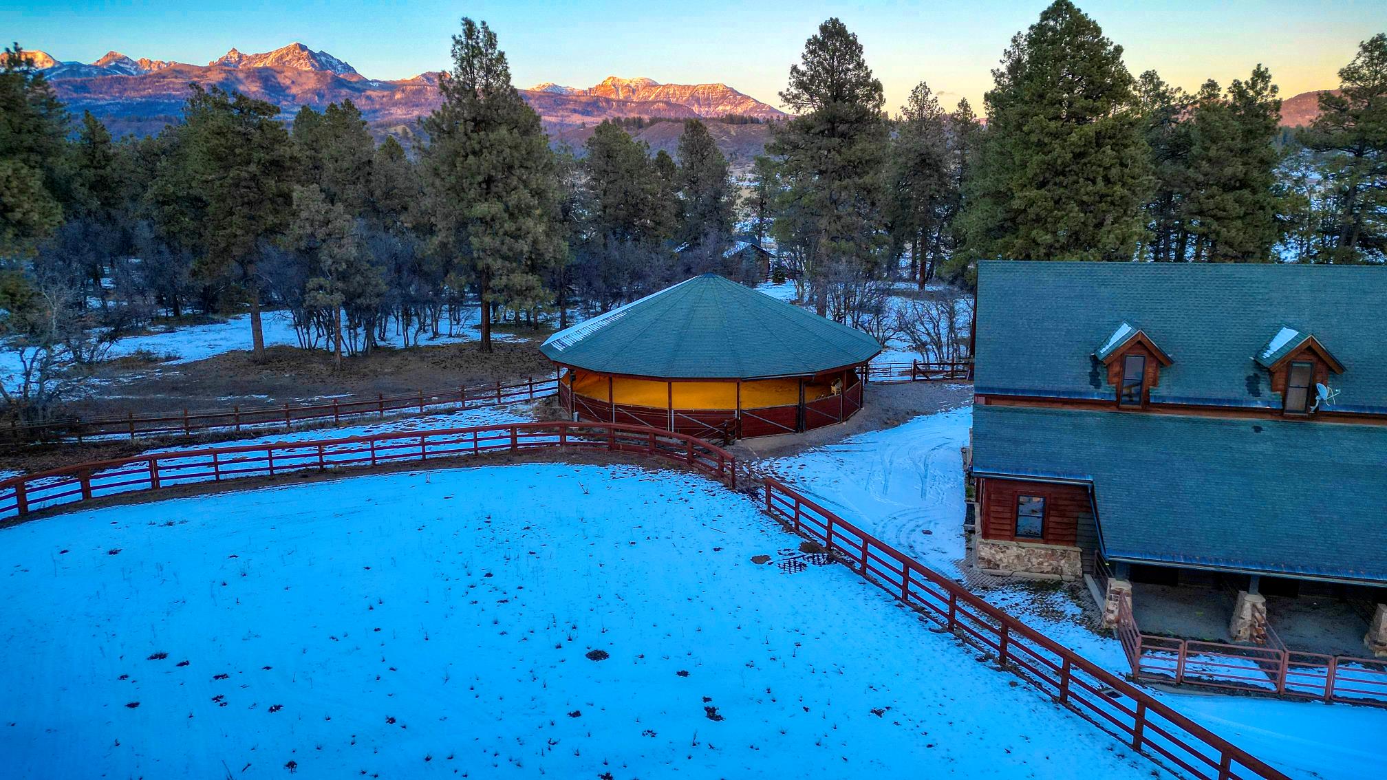 Winter aerial of the arena and covered round pen