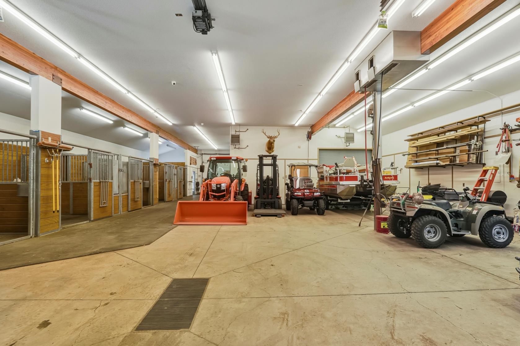 Barn interior with stalls and equipment bays