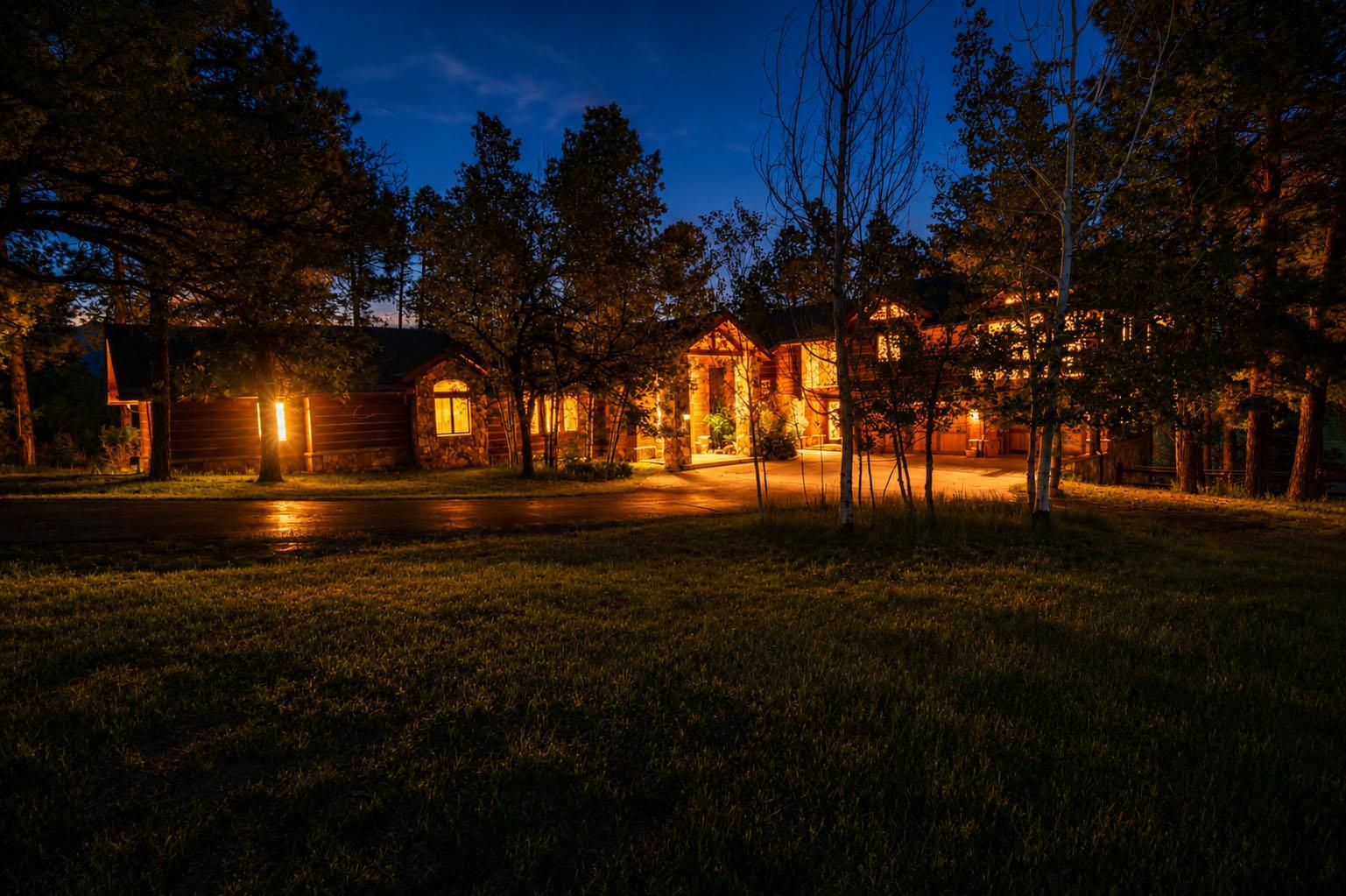 Main house front elevation at dusk