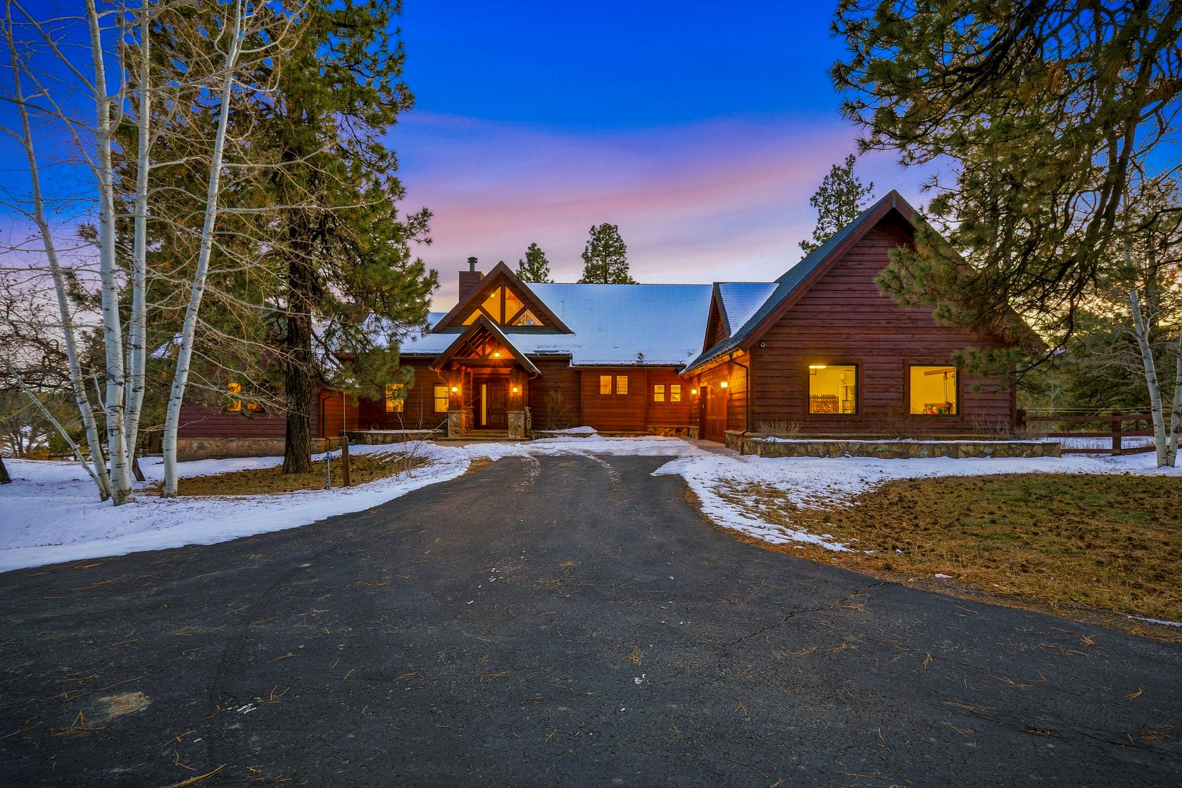 Guest house front elevation lit at dusk