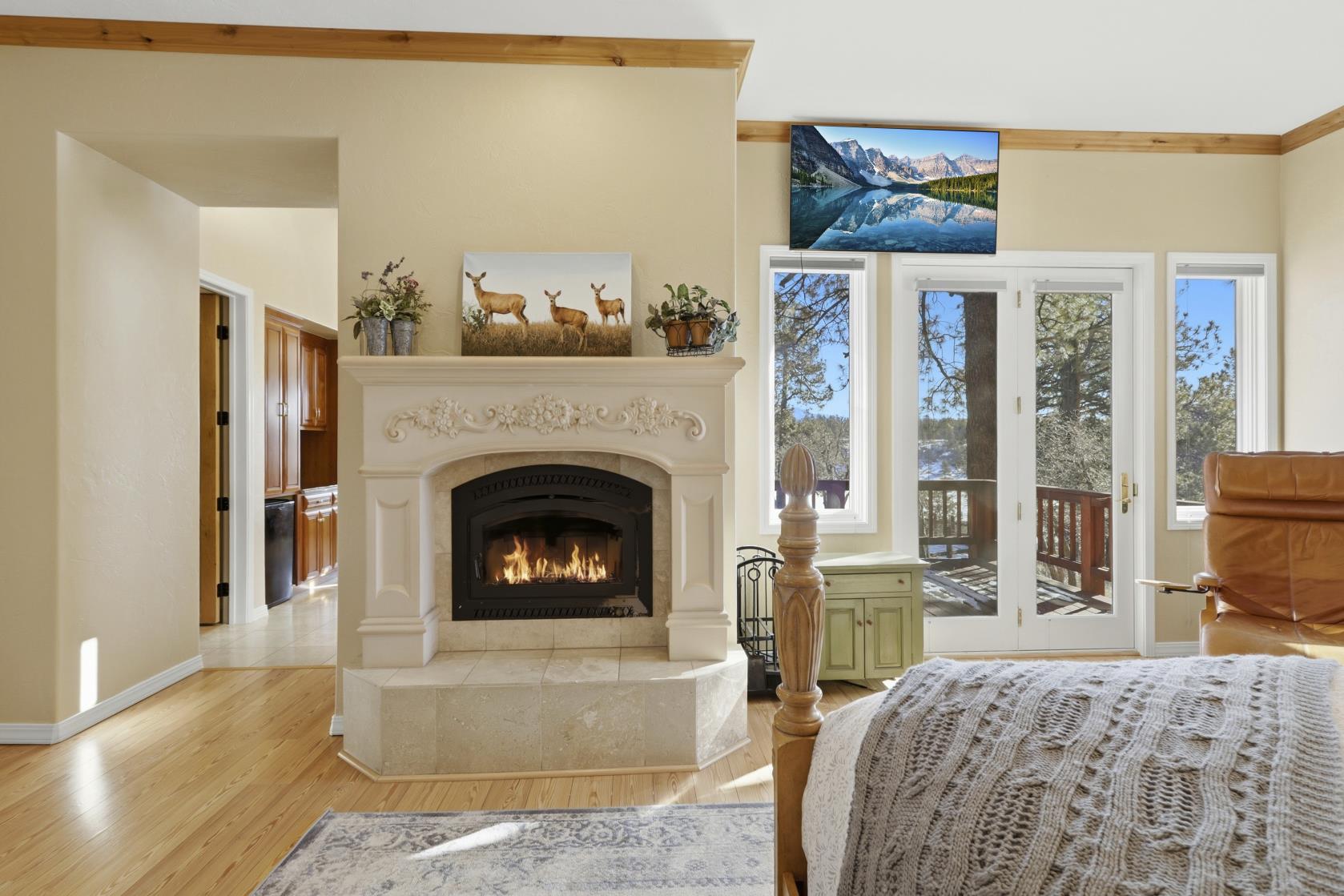 Guest house primary bedroom with fireplace