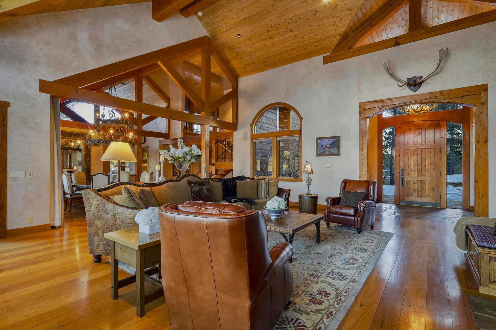 Great room and front entry with timber beams